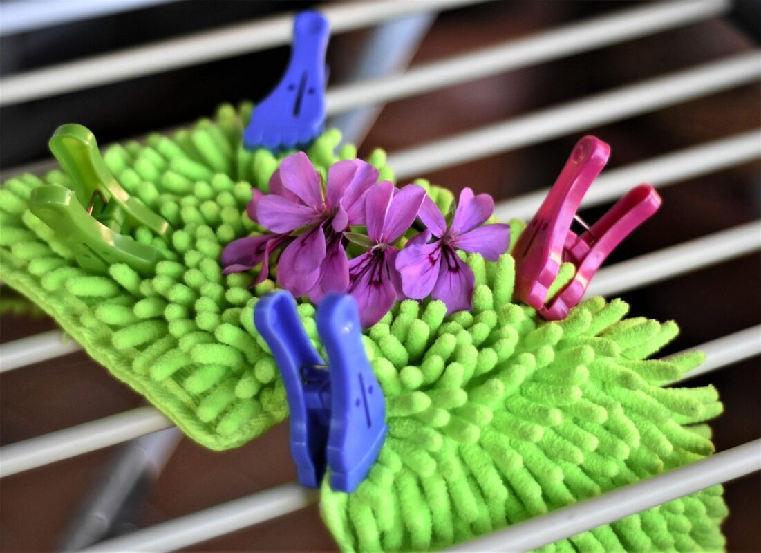 A mop hung up to dry after use